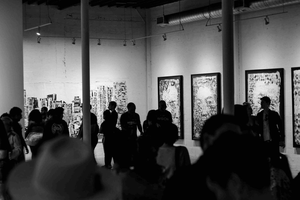 People attending an art exhibition during a major annual event in Miami.