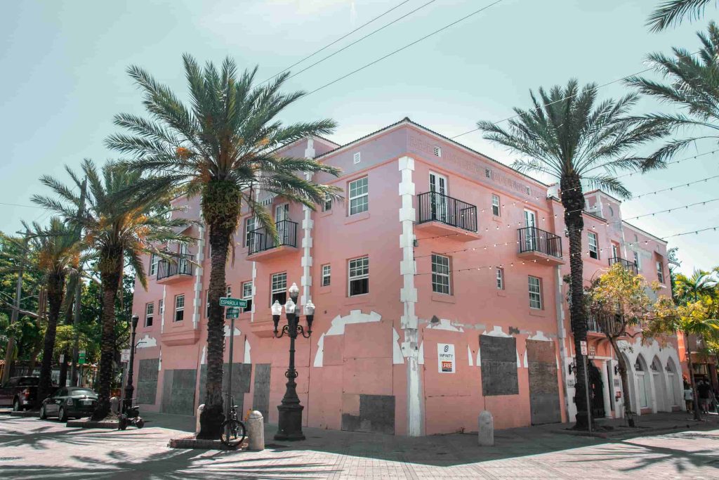 Historic pink building and palm trees in Little Havana Miami.