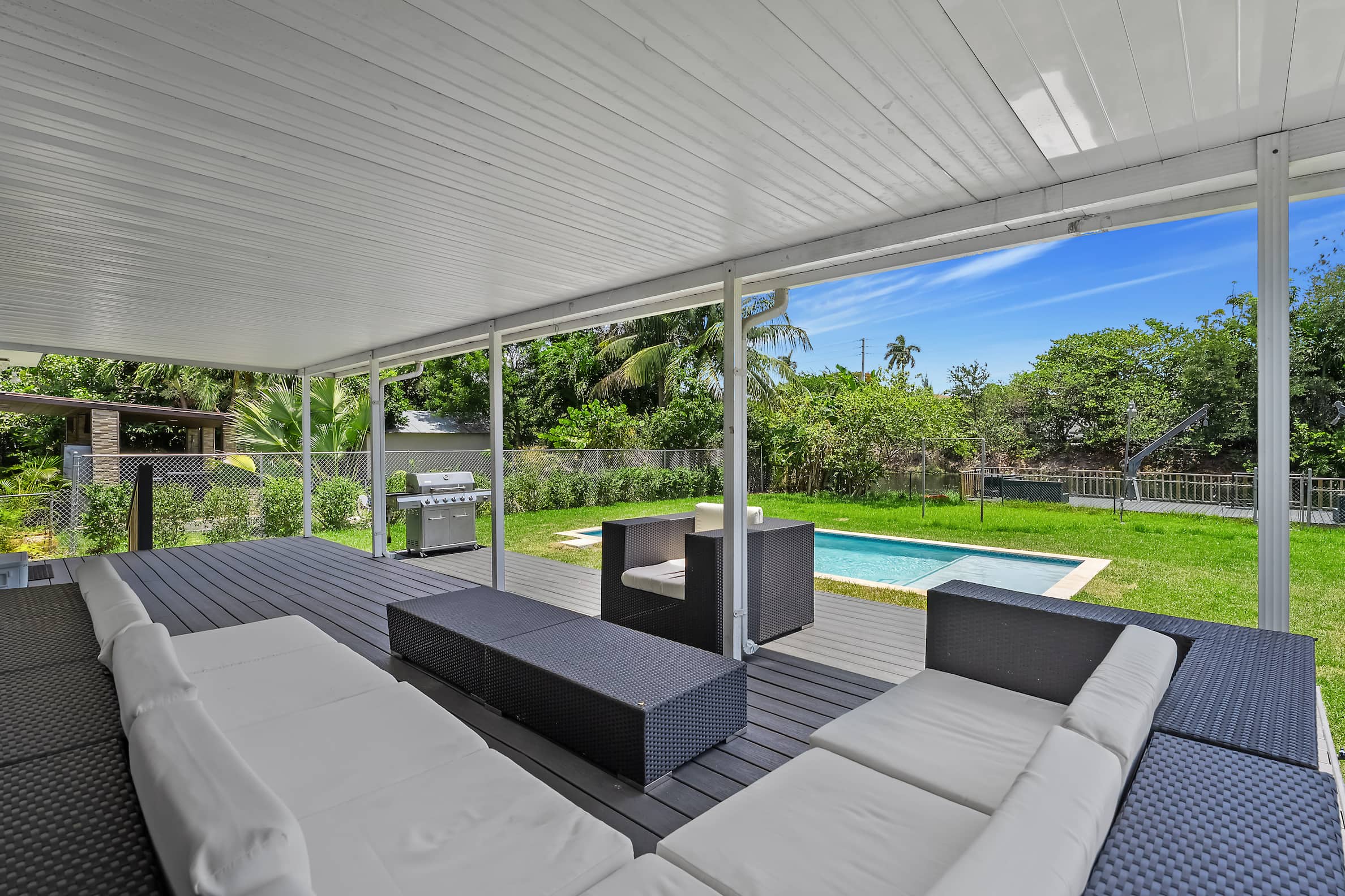 Covered patio with BBQ area in Hollywood Florida rental home