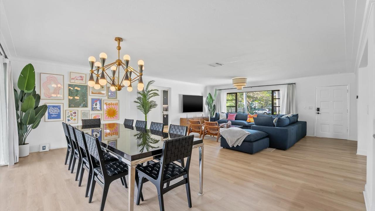Open-plan dining and living room inside Biscayne River House